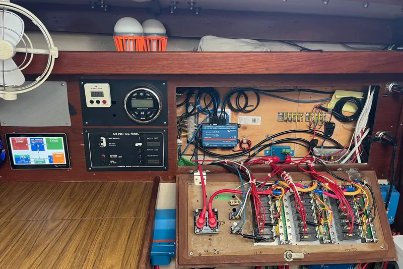 Slide: The Image of Electrical panel of a 1986 Catalina 36 MK1 sailboat with wiring and controls. - 17