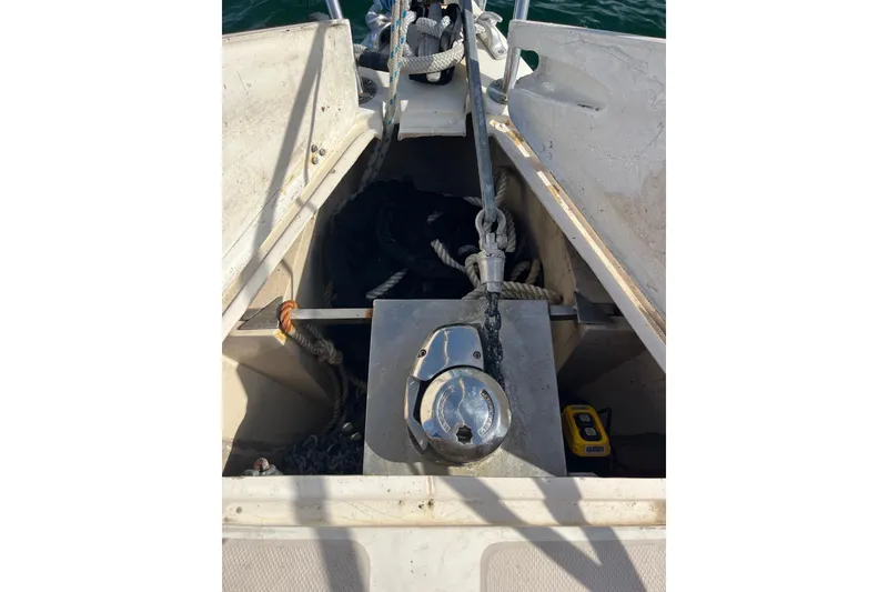 Slide: The Image of Anchor locker of 1986 Catalina 36 MK1 sailboat with ropes and winch. - 2