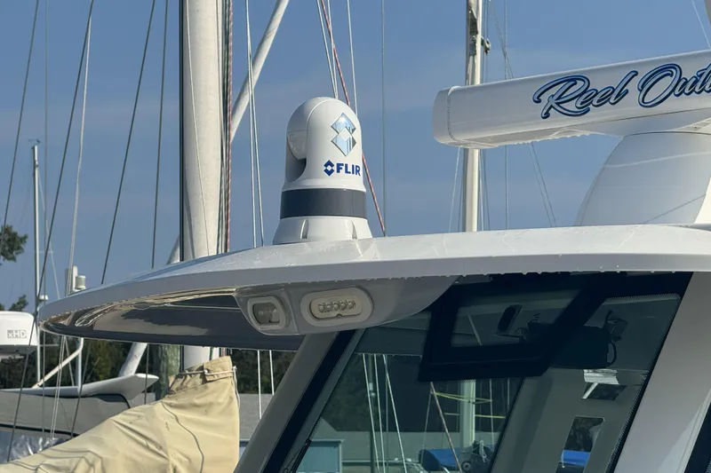 Slide: The Image of 2019 Sailfish 360 CC boat with FLIR camera and radar equipment on deck. - 12