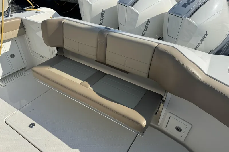 Slide: The Image of 2019 Sailfish 360 CC boat with beige seating and Mercury engines. - 13