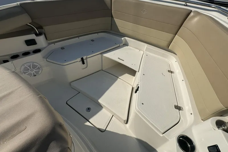 Slide: The Image of 2019 Sailfish 360 CC boat interior with storage compartments and seating. - 35