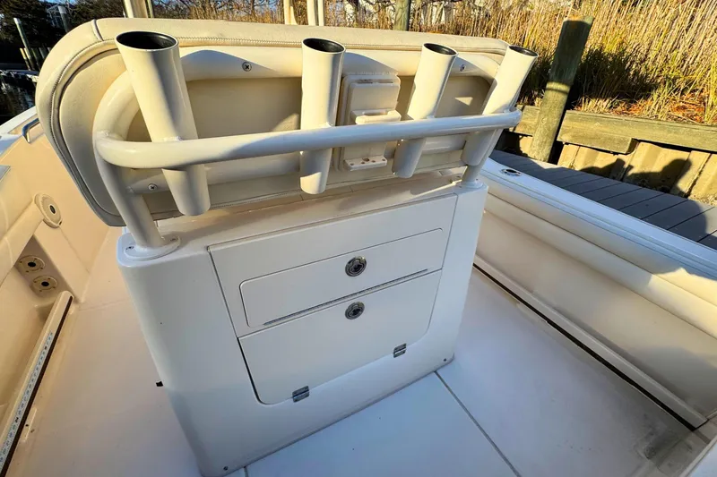 Slide: The Image of 2018 Grady-White Fisherman 216 boat interior with rod holders and storage compartments. - 10