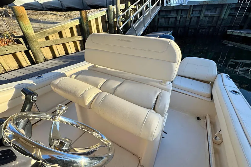 Slide: The Image of 2018 Grady-White Fisherman 216 boat interior with steering wheel and seating. - 12