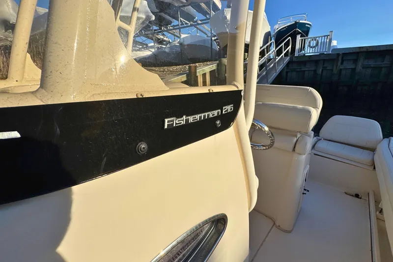 Slide: The Image of 2018 Grady-White Fisherman 216 boat interior with seating and console details. - 15