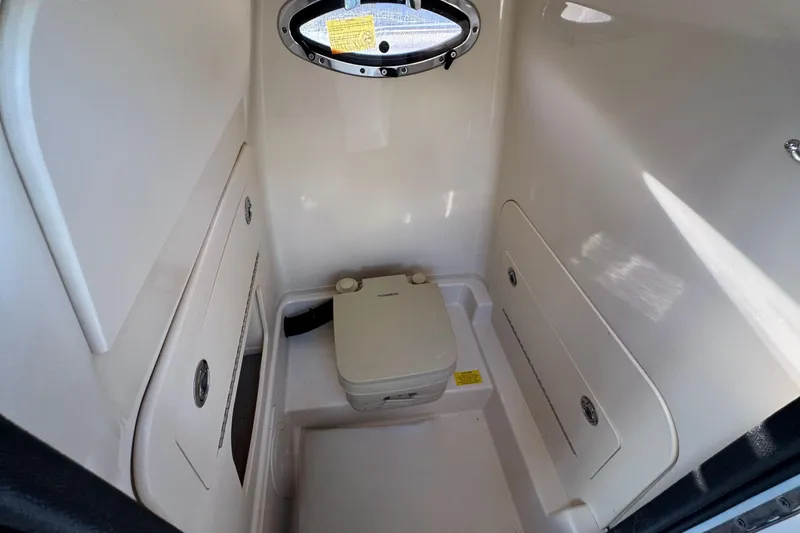 Slide: The Image of 2018 Grady-White Fisherman 216 boat interior with compact marine toilet. - 16
