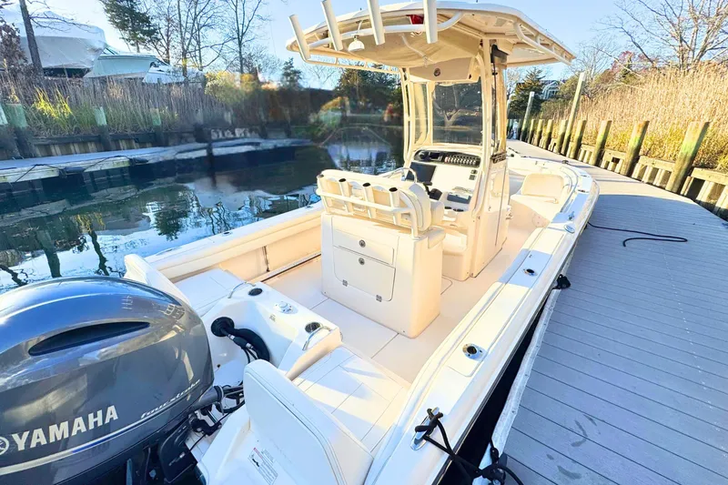 Slide: The Image of 2018 Grady-White Fisherman 216 boat docked, featuring Yamaha outboard motor. - 4