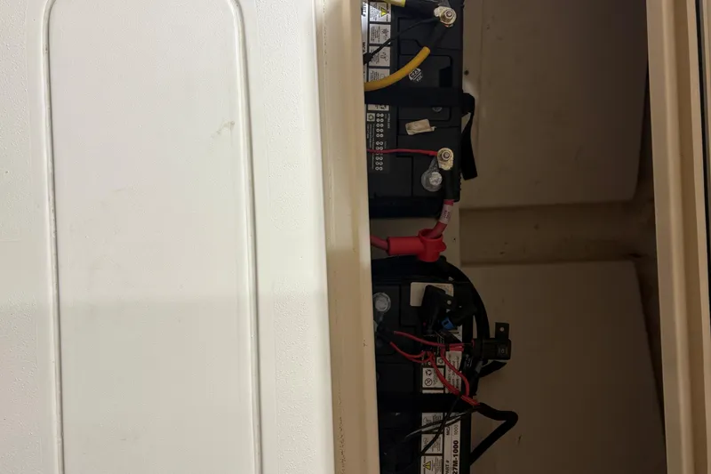Slide: The Image of Battery compartment of the 2024 Scout 215 Dorado boat. - 18