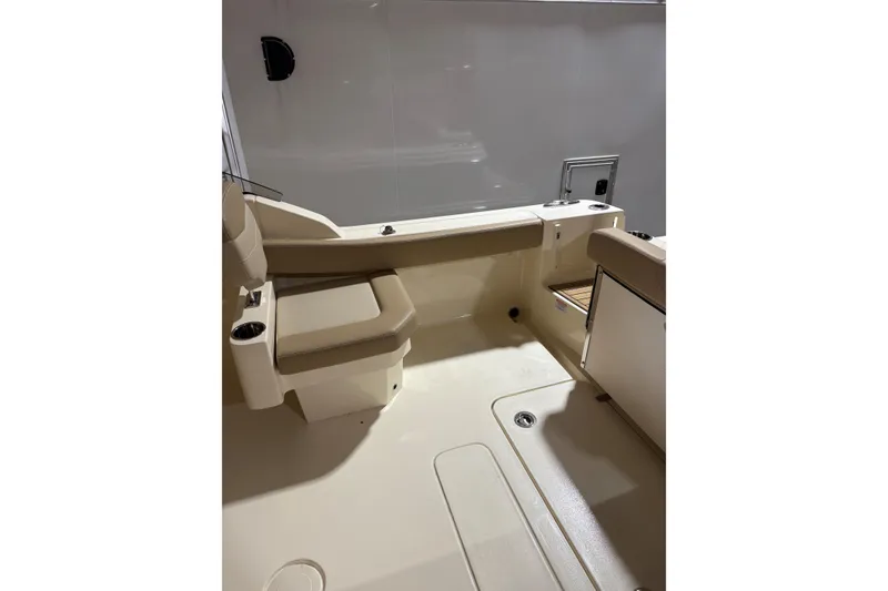 Slide: The Image of 2024 Scout 215 Dorado boat interior with seating and storage compartments. - 4