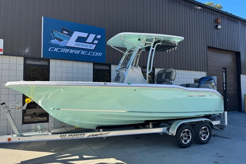 Slide: The Image of 2026 Key West 219 FS boat on trailer outside CIC Marine building. - 1