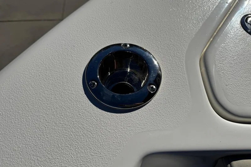 Slide: The Image of Close-up of a 2026 Key West 219 FS boat's stainless steel cup holder. - 13
