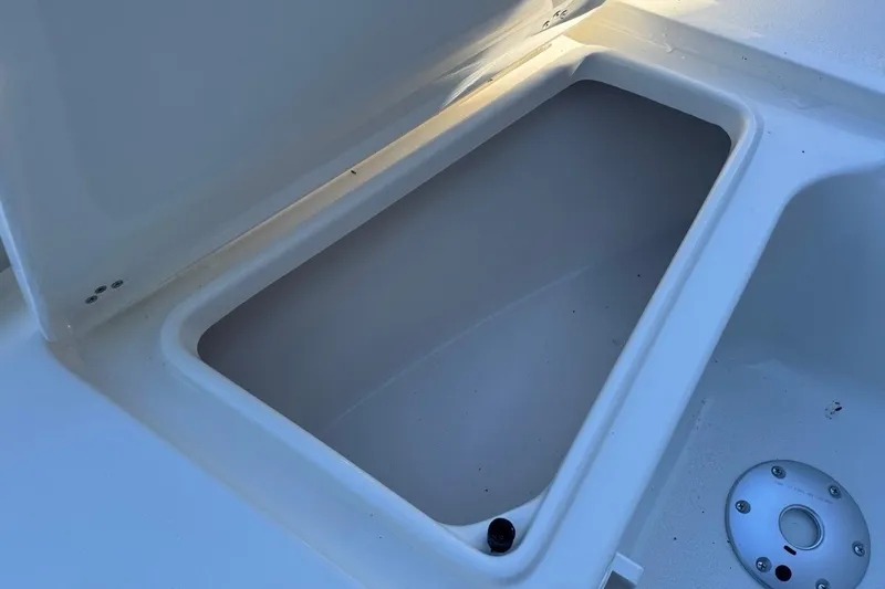 Slide: The Image of Open storage compartment on 2026 Key West 219 FS boat, showcasing interior space. - 15