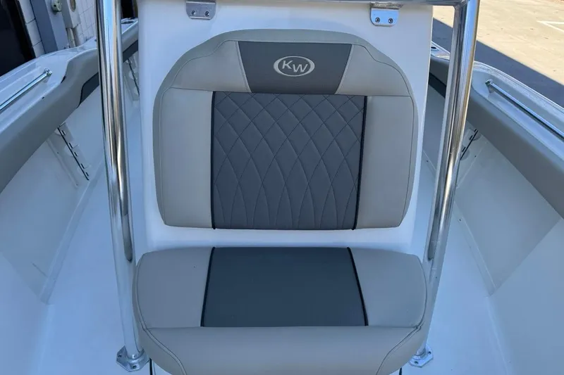 Slide: The Image of 2026 Key West 219 FS boat seat with gray and beige upholstery. - 16