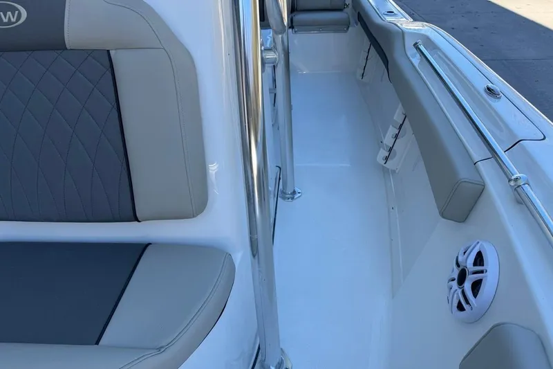 Slide: The Image of 2026 Key West 219 FS boat interior with cushioned seating and speaker. - 18