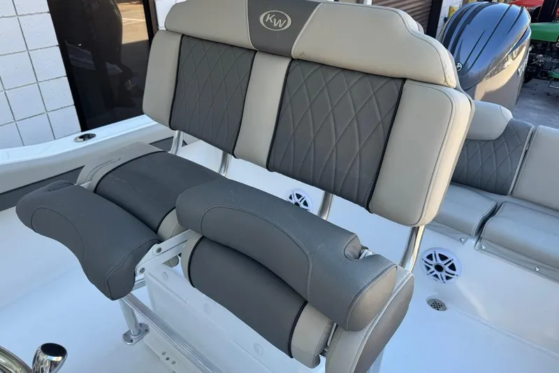 Slide: The Image of 2026 Key West 219 FS boat seating with gray and beige upholstery. - 22