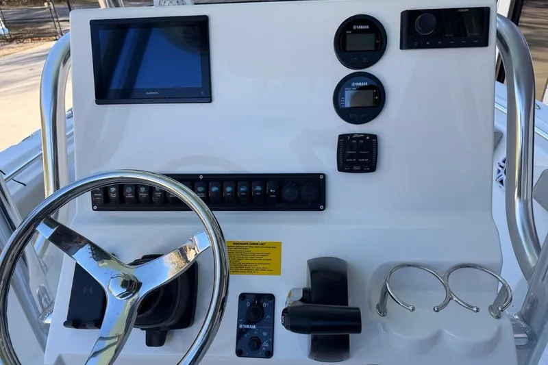 Slide: The Image of Steering console of 2026 Key West 219 FS boat with modern controls and displays. - 25
