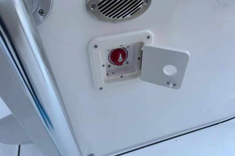Slide: The Image of 2026 Key West 219 FS boat battery switch and speaker detail. - 28
