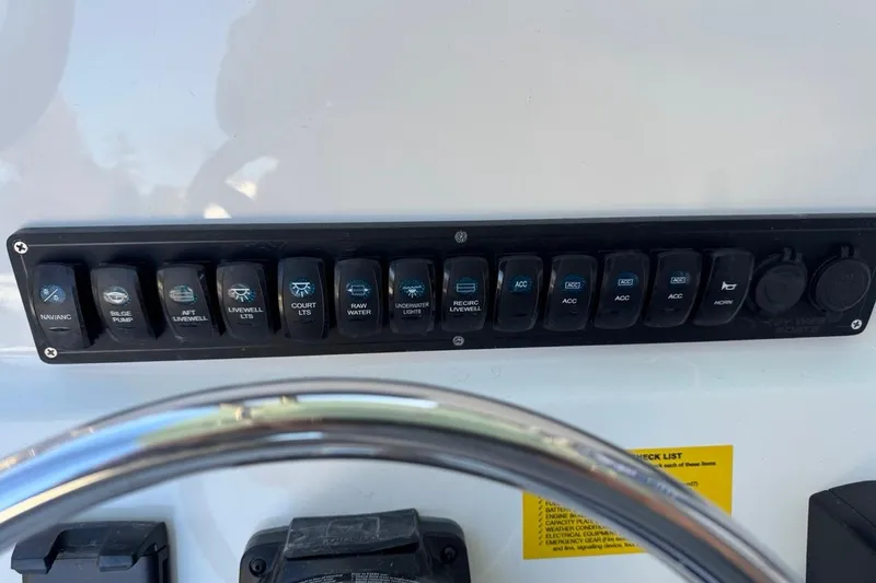Slide: The Image of Control panel of 2026 Key West 219 FS boat with various switches and labels. - 30