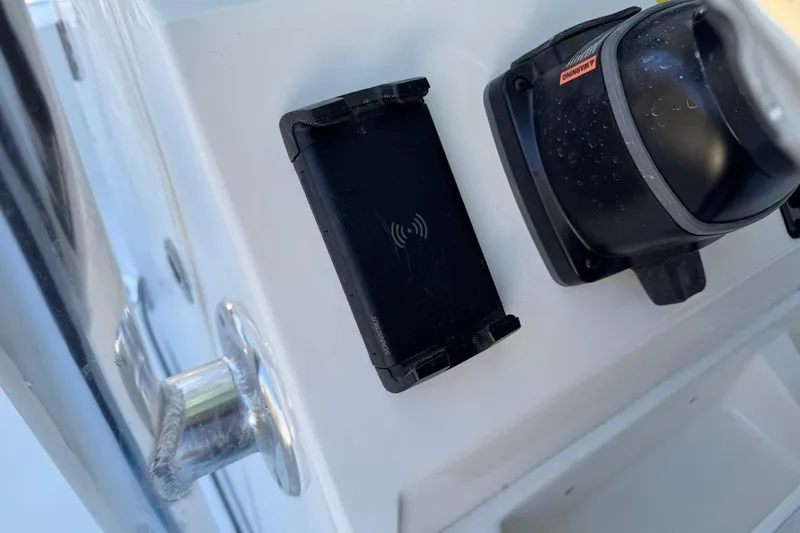 Slide: The Image of Key West 219 FS 2026 boat console with wireless charging pad and navigation equipment. - 31