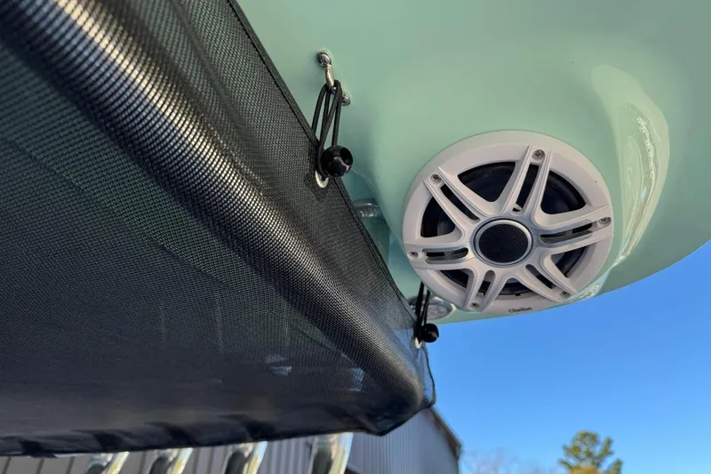 Slide: The Image of 2026 Key West 219 FS boat speaker and canopy detail under clear sky. - 34