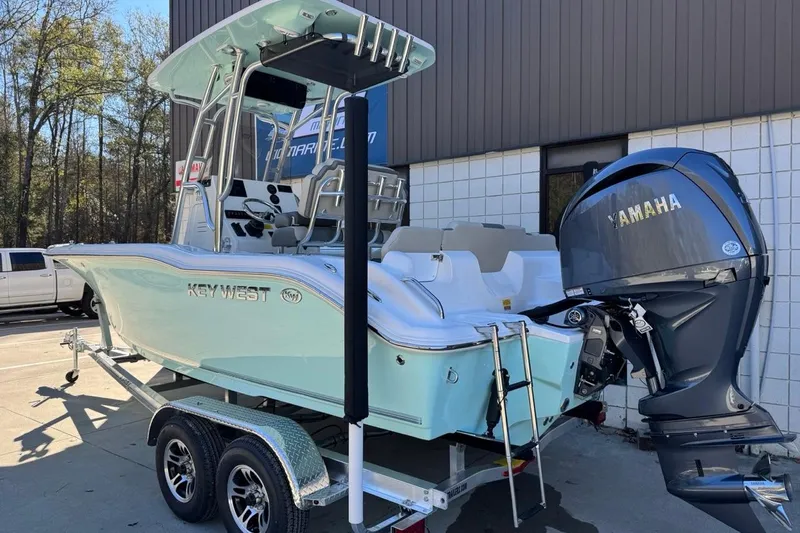 Slide: The Image of 2026 Key West 219 FS boat with Yamaha engine on trailer, parked outdoors. - 4