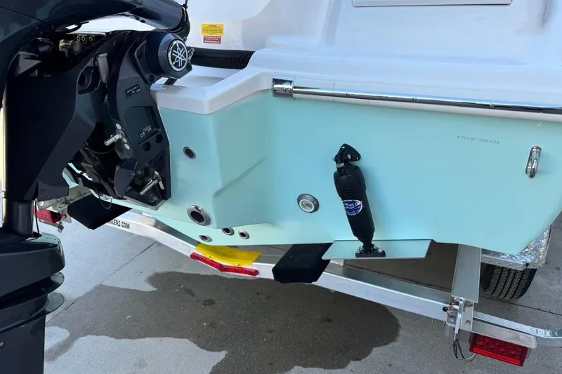 Slide: The Image of 2026 Key West 219 FS boat transom with motor and trailer detail. - 7