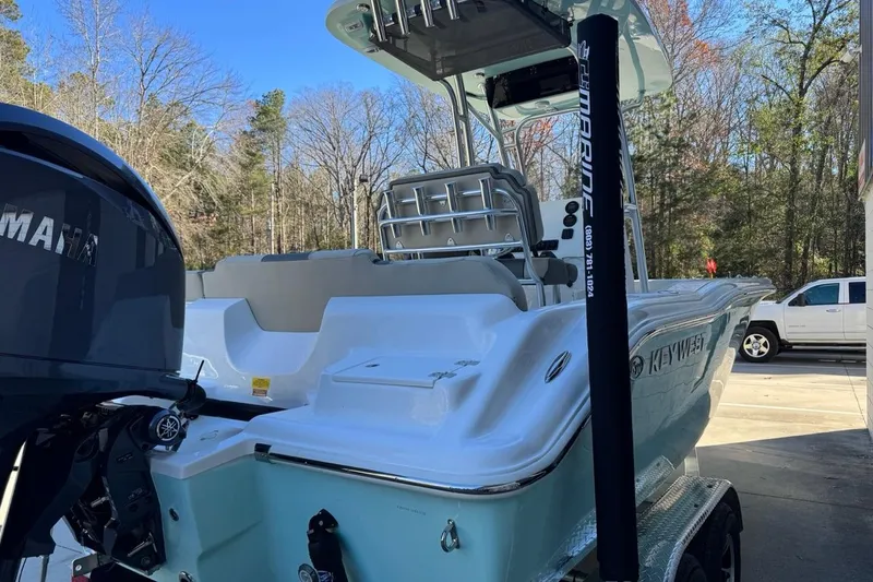 Slide: The Image of 2026 Key West 219 FS boat with Yamaha engine, parked outdoors on a trailer. - 8