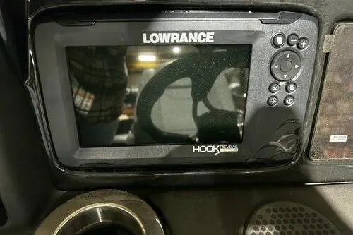 Slide: The Image of Lowrance Hook Reveal fish finder on 2025 Regency 230 DL3 boat dashboard. - 7