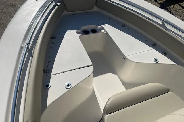 Slide: The Image of 2023 Key West 219 FS boat interior with seating and storage compartments. - 14