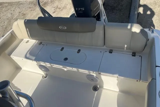 Slide: The Image of 2023 Key West 219 FS boat interior with seating and storage compartments. - 6