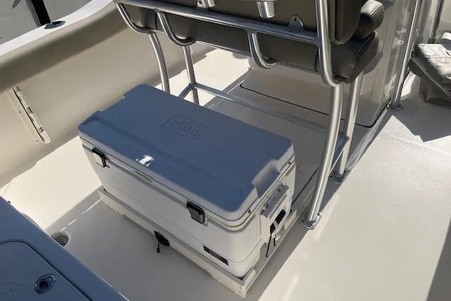 Slide: The Image of 2023 Key West 219 FS boat interior with cooler and seating area. - 9