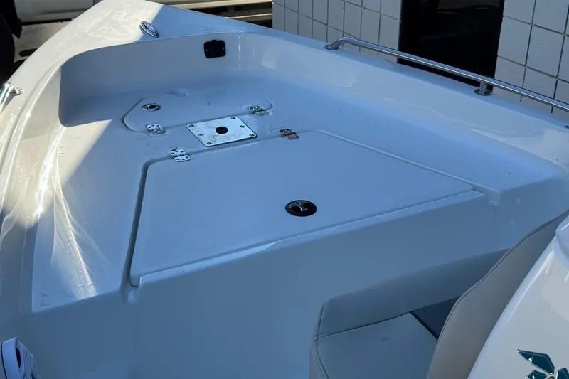 Slide: The Image of 2026 Key West 1720 Center Console boat deck, featuring sleek design and modern fittings. - 13