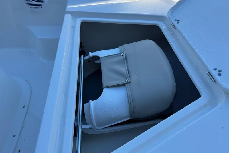 Slide: The Image of Storage compartment in 2026 Key West 1720 Center Console boat with cushioned seat. - 21