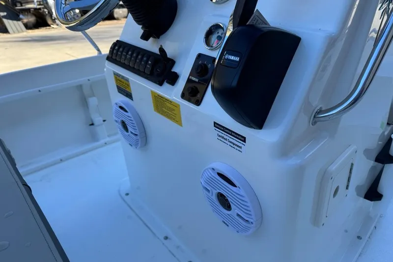 Slide: The Image of 2026 Key West 1720 Center Console boat dashboard with Yamaha controls and speakers. - 22