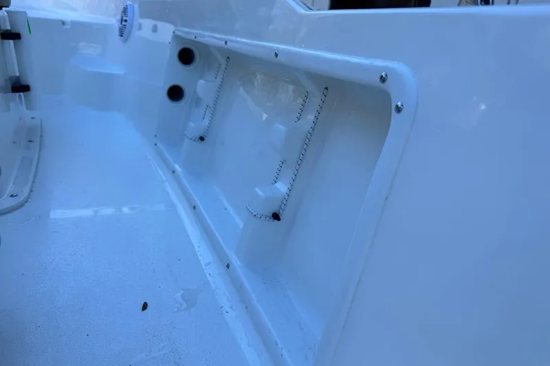 Slide: The Image of 2026 Key West 1720 Center Console interior detail, showcasing sleek white design and storage compartments. - 24