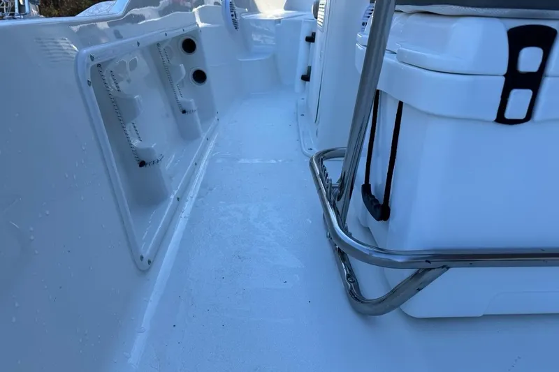 Slide: The Image of 2026 Key West 1720 Center Console boat interior with storage compartments and seating. - 25