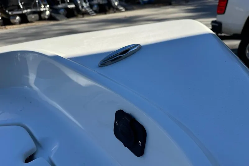 Slide: The Image of 2026 Key West 1720 Center Console boat detail with cleat and plug socket. - 29