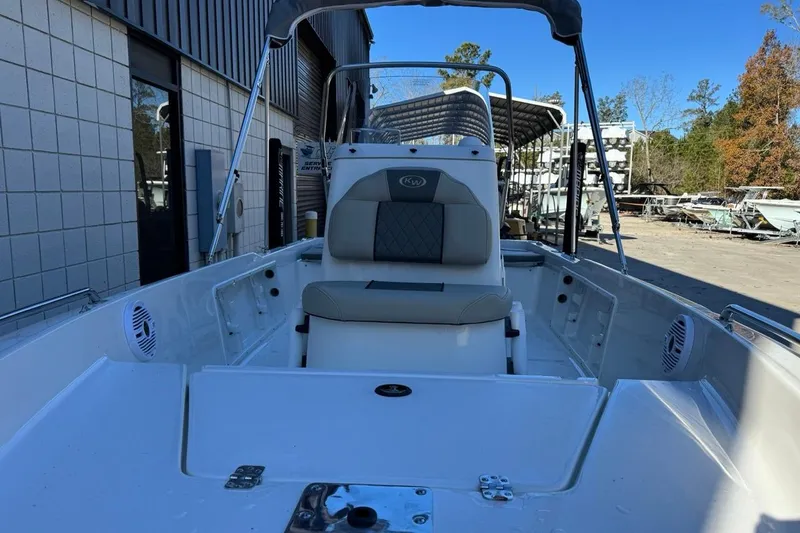 Slide: The Image of 2026 Key West 1720 Center Console boat with seating, docked outdoors. - 7