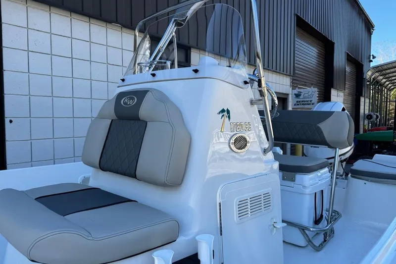 Slide: The Image of 2026 Key West 1720 Center Console boat with cushioned seating and sleek design. - 8