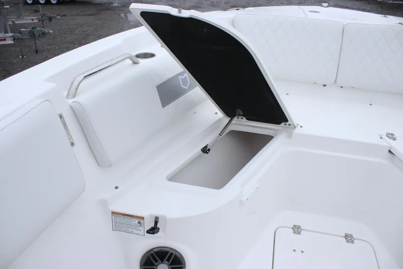Slide: The Image of 2026 Sea Fox 268 Commander boat storage compartment with open hatch and cushioned seating. - 11