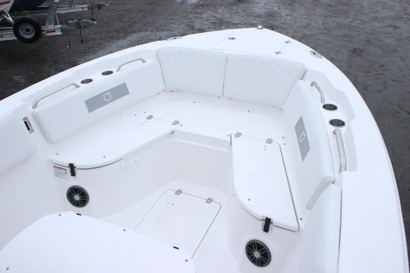 Slide: The Image of 2026 Sea Fox 268 Commander boat interior with white seating and storage compartments. - 6