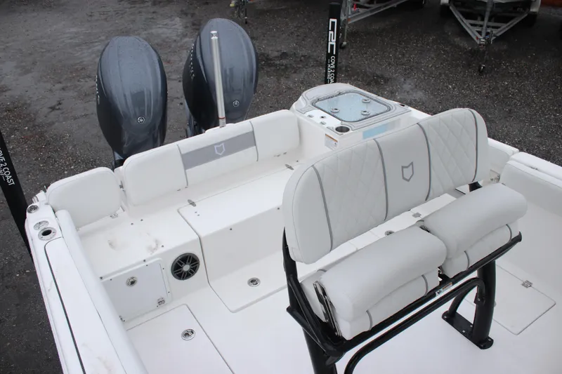 Slide: The Image of 2026 Sea Fox 268 Commander boat interior with dual engines and cushioned seating. - 7