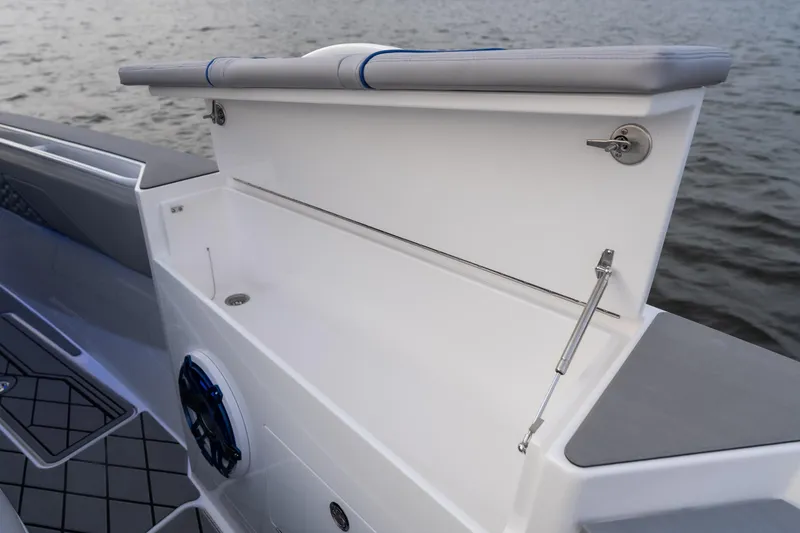 Slide: The Image of 2026 Fountain 38 SCX boat interior detail with storage compartment and speaker. - 11