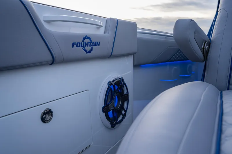 Slide: The Image of 2026 Fountain 38 SCX boat interior with blue LED lighting and speaker detail. - 15