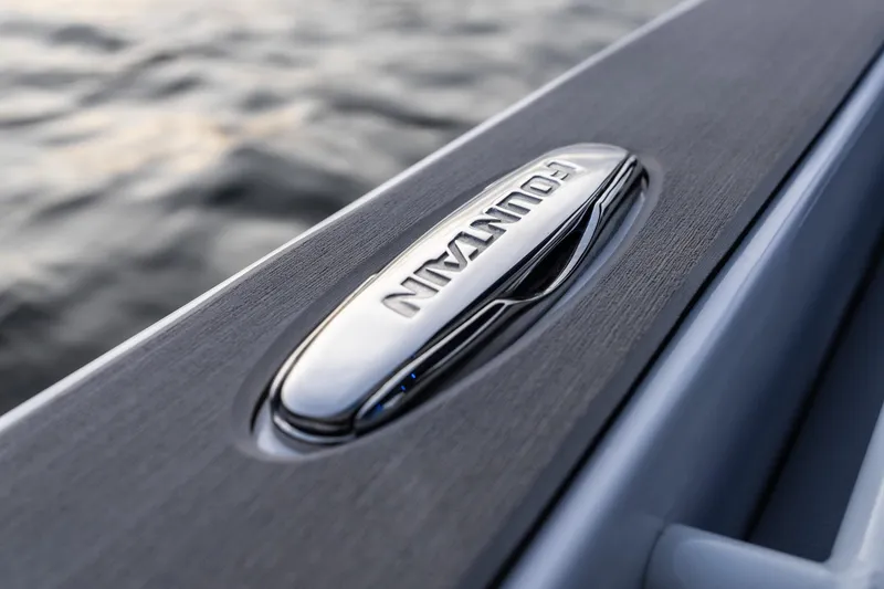 Slide: The Image of Close-up of 2026 Fountain 38 SCX boat logo on sleek surface by water. - 16