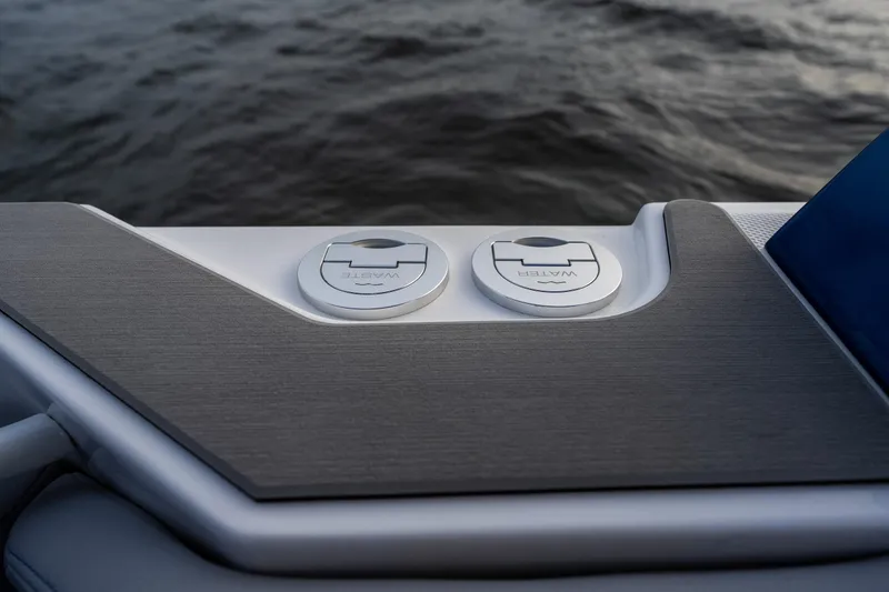 Slide: The Image of 2026 Fountain 38 SCX boat deck with waste and water access panels. - 18