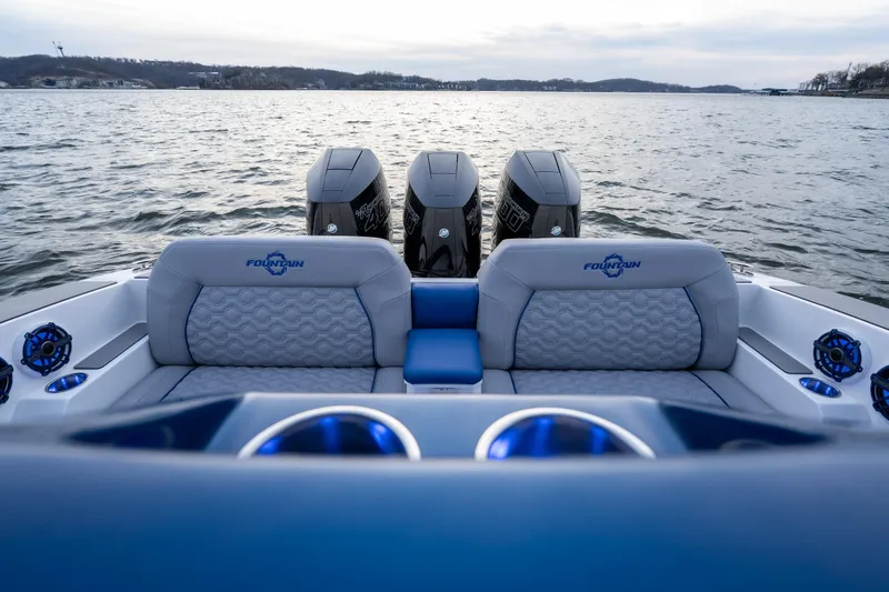 Slide: The Image of 2026 Fountain 38 SCX boat with triple engines on a calm lake. - 23