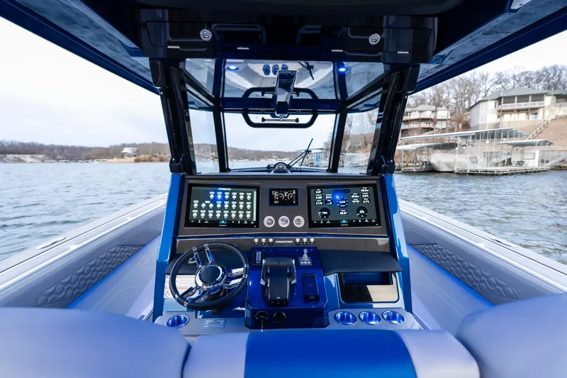 Slide: The Image of 2026 Fountain 38 SCX boat cockpit with advanced navigation system and sleek design. - 24