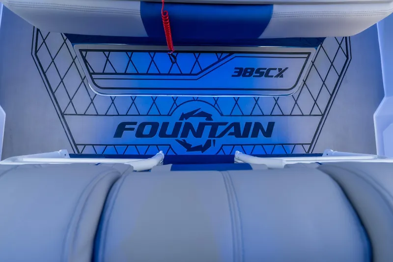 Slide: The Image of 2026 Fountain 38 SCX boat interior with logo and blue lighting. - 25