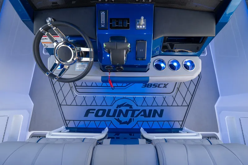 Slide: The Image of 2026 Fountain 38 SCX boat cockpit with modern steering and controls. - 26