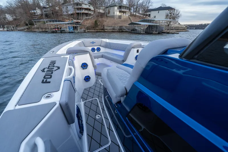 Slide: The Image of 2026 Fountain 38 SCX boat interior with modern seating and waterfront view. - 30